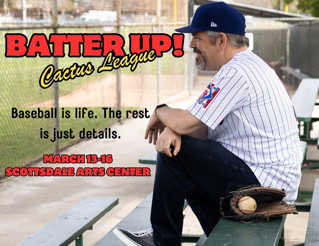 A man in a blue baseball cap and a white pinstriped jersey sits on a bench at a baseball field, leaning forward with a smile. His right arm rests on his knee, and a brown leather baseball glove with a baseball inside sits beside him on the bench. The background features a chain-link fence and a baseball diamond. The image includes bold red and yellow text reading "BATTER UP! Cactus League" at the top, and below it, black text stating, "Baseball is life. The rest is just details."